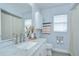 Well-lit bathroom with a marble vanity, modern fixtures, and decorative accents at 9813 Woodbay Dr, Tampa, FL 33626