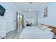 Bright bedroom with wood headboard, sliding door access to pool area and dedicated exercise equipment at 9813 Woodbay Dr, Tampa, FL 33626