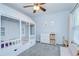 Playful bedroom with a decorative bed frame, dresser, and ceiling fan at 9813 Woodbay Dr, Tampa, FL 33626