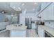Kitchen showcasing granite countertops, stainless steel appliances, and seamless transition to living space at 9813 Woodbay Dr, Tampa, FL 33626