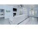 The living room features a fireplace, lots of light and wood-look flooring at 9813 Woodbay Dr, Tampa, FL 33626
