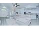 Bright open-concept living room with modern finishes and a spacious seating area, flowing into a modern kitchen at 9813 Woodbay Dr, Tampa, FL 33626