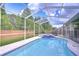 Gorgeous pool and spa area with a screened lanai for outdoor enjoyment at 9813 Woodbay Dr, Tampa, FL 33626