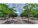 Brick-paved town center framed by trees, benches and shops in a vibrant commercial area at 9813 Woodbay Dr, Tampa, FL 33626
