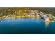 Expansive aerial view of waterfront community with private docks and lush landscaping at 100 Bluff View Dr # 511C, Belleair Bluffs, FL 33770