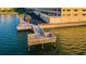 Community dock overlooking tranquil water; an ideal spot for relaxing and enjoying the scenery at 100 Bluff View Dr # 511C, Belleair Bluffs, FL 33770