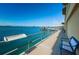 Community waterfront dock with benches, clear blue water, and community boat slips at 100 Bluff View Dr # 511C, Belleair Bluffs, FL 33770
