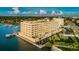 Waterfront condo building featuring stunning bay views, private docks, and lush landscaping at 100 Bluff View Dr # 511C, Belleair Bluffs, FL 33770