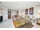 Inviting living room featuring a fireplace, neutral tones, comfortable seating, and an open layout to the dining area at 100 Bluff View Dr # 511C, Belleair Bluffs, FL 33770