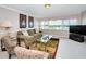 Comfortable living room with serene bay views, perfect for relaxing and entertaining guests at 100 Bluff View Dr # 511C, Belleair Bluffs, FL 33770