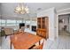 Open living space combining a dining area and living room with natural light and serene waterfront views at 100 Bluff View Dr # 511C, Belleair Bluffs, FL 33770