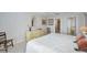 Main bedroom featuring a bed, vanity, art, and access to the Primary bath at 100 Bluff View Dr # 511C, Belleair Bluffs, FL 33770