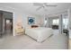 Main bedroom featuring a bed, fan, and access to the living area at 100 Bluff View Dr # 511C, Belleair Bluffs, FL 33770