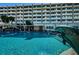 Dive into a shimmering pool with a dolphin water feature at this condo complex at 100 Bluff View Dr # 511C, Belleair Bluffs, FL 33770
