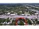 Aerial view showcasing the property's location in a neighborhood with mature trees and easy access to the main road at 1019 E Mohawk Ave, Tampa, FL 33604