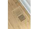 Close-up of wooden floor vent set into hardwood floor at 1019 E Mohawk Ave, Tampa, FL 33604