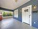 Inviting front porch with a well-lit entrance, creating a warm and welcoming ambiance for guests at 1019 E Mohawk Ave, Tampa, FL 33604