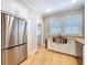 Spacious kitchen featuring stainless steel appliances, butcher block countertops, and ample cabinet space at 1019 E Mohawk Ave, Tampa, FL 33604
