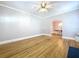 Open living area boasting hardwood floors and a seamless transition to the dining space, perfect for entertaining at 1019 E Mohawk Ave, Tampa, FL 33604