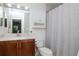 Updated bathroom featuring modern vanity, sleek fixtures, and shower with chevron curtain at 10265 Gandy N Blvd # 1702, St Petersburg, FL 33702