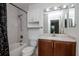 Bathroom featuring a shower-tub combo, and modern vanity with sleek fixtures and bright lighting, creating a refreshing space at 10265 Gandy N Blvd # 1702, St Petersburg, FL 33702