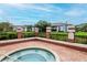 Community hot tub with brick border and beautiful landscaping at 10265 Gandy N Blvd # 1702, St Petersburg, FL 33702