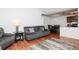 Open concept living room flowing into the dining area and kitchen, featuring hardwood floors and modern furnishings at 10265 Gandy N Blvd # 1702, St Petersburg, FL 33702