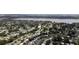 An aerial view showcases the property's location within a vibrant neighborhood near a lake at 10408 118Th Ave, Largo, FL 33773