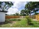 The home features a spacious back yard with a wood privacy fence and mature trees is ready for a new owner at 10408 118Th Ave, Largo, FL 33773