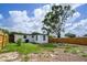 The home features a spacious back yard with a wood privacy fence and mature trees is ready for a new owner at 10408 118Th Ave, Largo, FL 33773