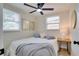 Comfortable bedroom with natural light, neutral tones, and a ceiling fan at 10408 118Th Ave, Largo, FL 33773