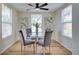 Bright dining area featuring a modern ceiling fan and natural light at 10408 118Th Ave, Largo, FL 33773