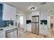 Updated kitchen with stainless steel appliances, subway tile, and ample cabinet space at 10408 118Th Ave, Largo, FL 33773
