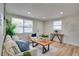 Beautifully staged living room filled with natural light, stylish decor, and a comfortable seating area at 10408 118Th Ave, Largo, FL 33773