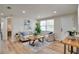 Bright living room featuring modern furnishings, hardwood floors, and a neutral color palette at 10408 118Th Ave, Largo, FL 33773