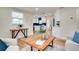 Open-concept living room offering views of the kitchen with a modern backsplash at 10408 118Th Ave, Largo, FL 33773
