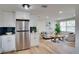 Open-concept layout showcasing the seamless flow between kitchen and living area at 10408 118Th Ave, Largo, FL 33773