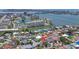 Aerial view of a waterfront community, showcasing a mix of residential homes and waterfront condos at 11490 48Th N Ave, St Petersburg, FL 33708