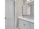 Bathroom featuring a white vanity with drawers, and a mirrored medicine cabinet at 11490 48Th N Ave, St Petersburg, FL 33708