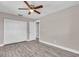 Bedroom with luxury vinyl floors, ceiling fan, and closet at 11490 48Th N Ave, St Petersburg, FL 33708