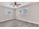 Bedroom featuring two windows and vinyl floors at 11490 48Th N Ave, St Petersburg, FL 33708