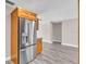Spacious kitchen featuring a stainless steel refrigerator and hardwood floors at 11490 48Th N Ave, St Petersburg, FL 33708