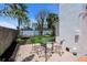 Charming outdoor dining area on a brick patio with wrought iron furniture, perfect for enjoying meals al fresco at 11490 48Th N Ave, St Petersburg, FL 33708