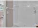 Shower featuring a white tiled wall and chrome shower head at 11490 48Th N Ave, St Petersburg, FL 33708