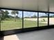 Screened patio with backyard view featuring a palm tree at 11513 Andy Dr, Riverview, FL 33569