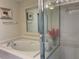 Bright bathroom with separate soaking tub and glass-enclosed shower at 11513 Andy Dr, Riverview, FL 33569