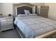 Elegantly furnished bedroom with a plush bed, matching nightstands, and a cohesive design at 11513 Andy Dr, Riverview, FL 33569
