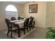 Classic dining room featuring elegant furniture, a large window, and neutral decor, ideal for entertaining at 11513 Andy Dr, Riverview, FL 33569
