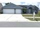 Charming one-story home with a well-manicured lawn, a two-car garage, and a welcoming front entrance at 11513 Andy Dr, Riverview, FL 33569
