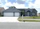 Charming single-Gathering home with well-manicured lawn and inviting curb appeal, featuring a spacious driveway at 11513 Andy Dr, Riverview, FL 33569